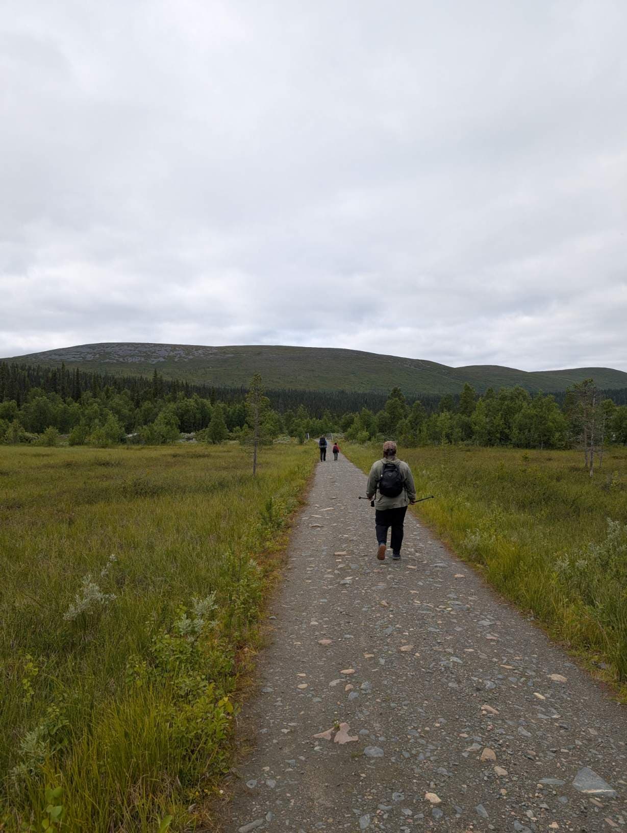 The day's destination is already visible in the open marshland at the start of the trail